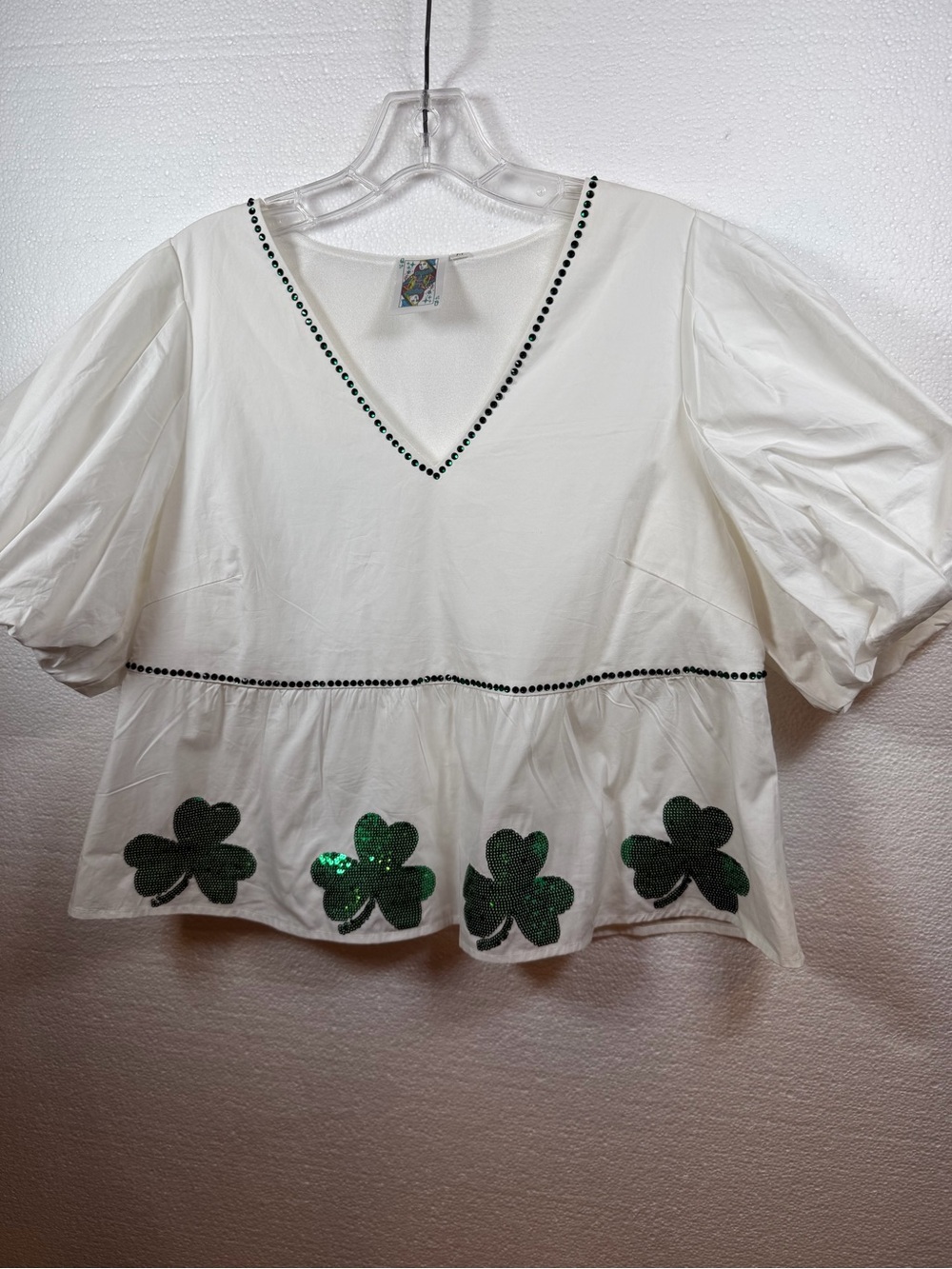 QUEEN OF SPARKLES White Peplum Top with Green Sequin Shamrocks